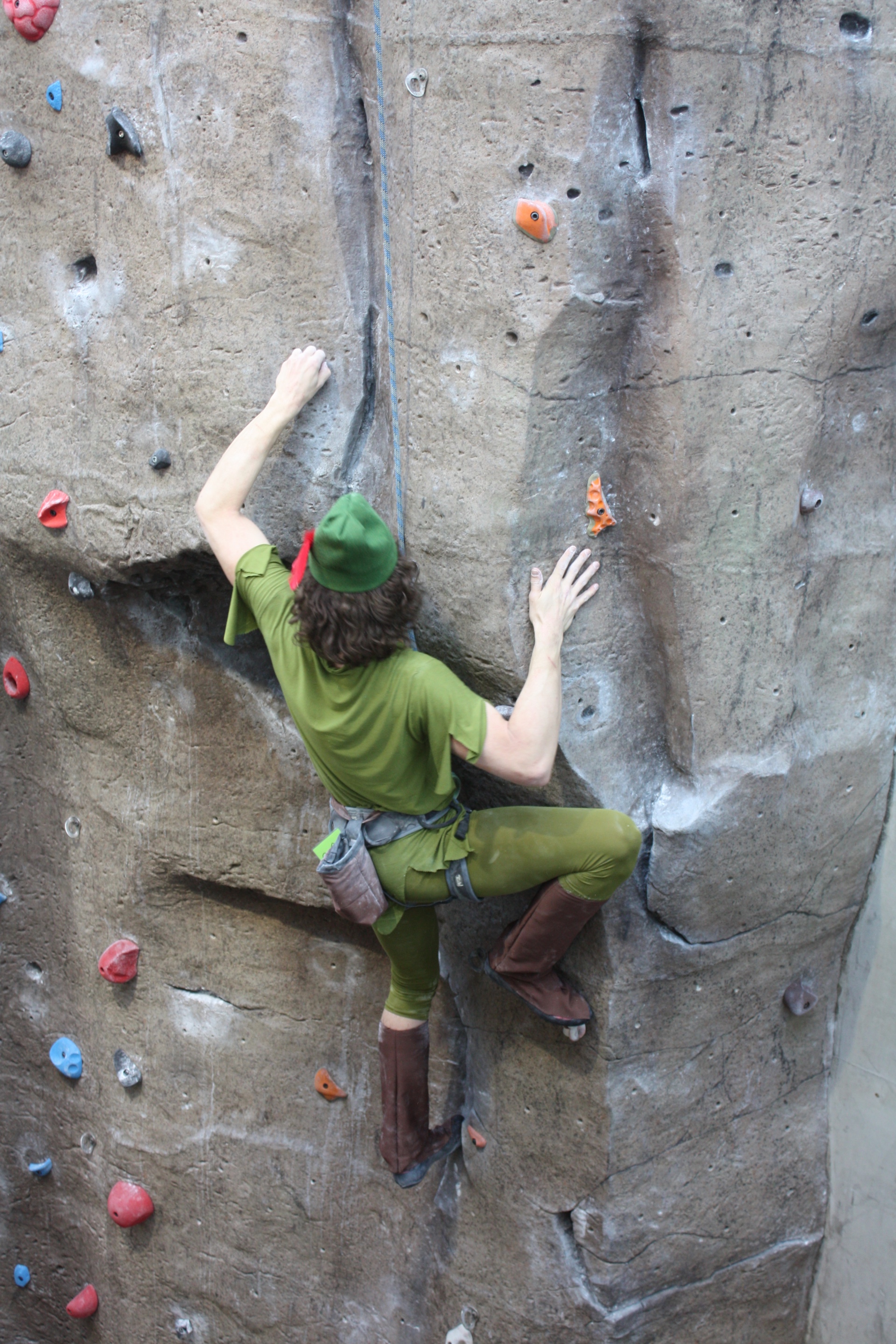 Photo of student climbing a wall in a halloween costume