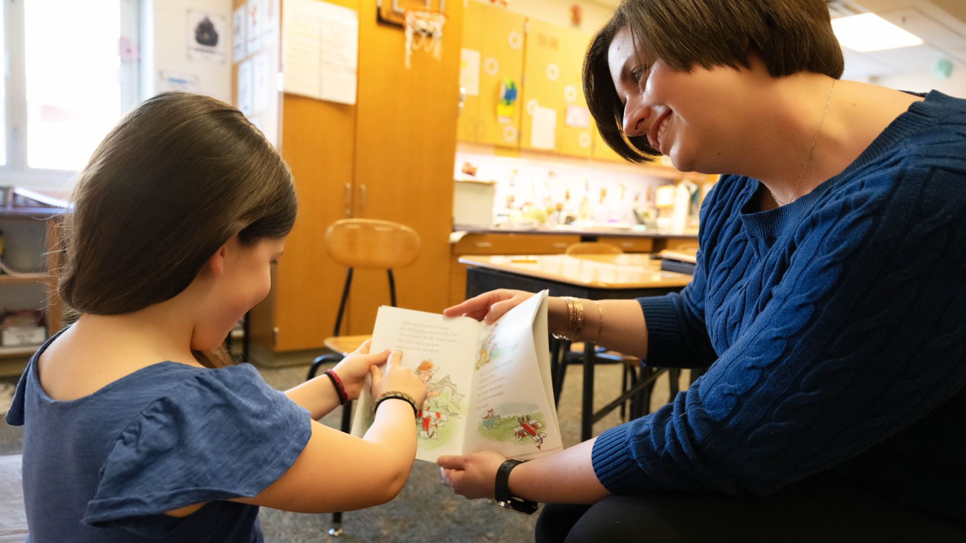 teacher talking with student