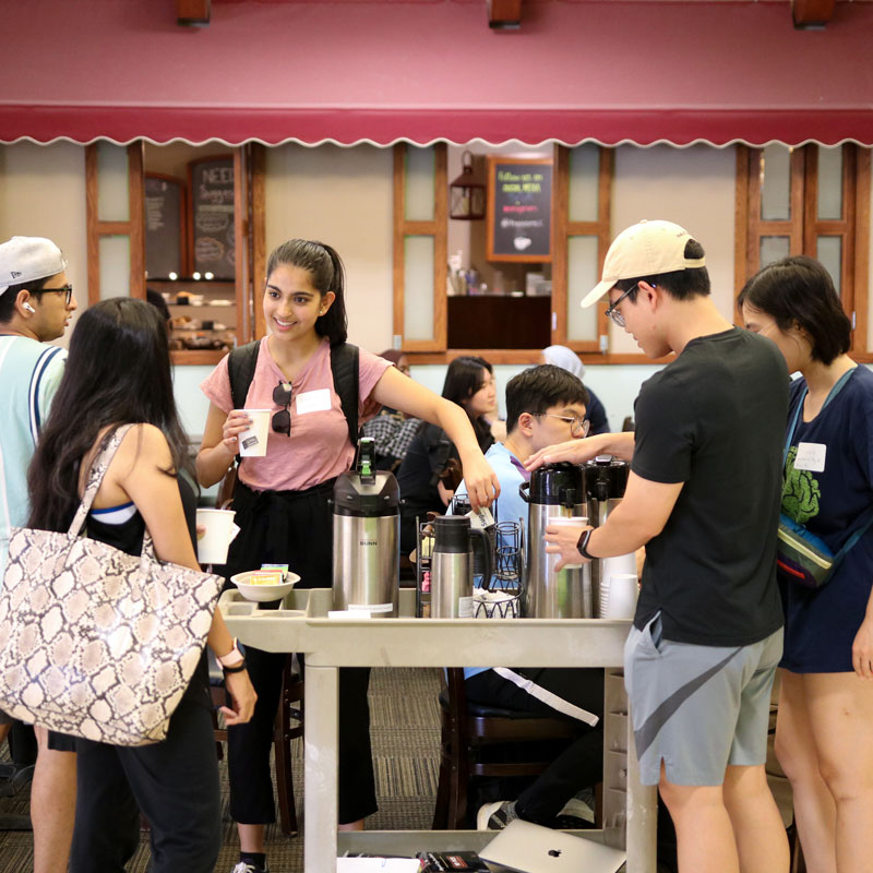 students serving up coffee