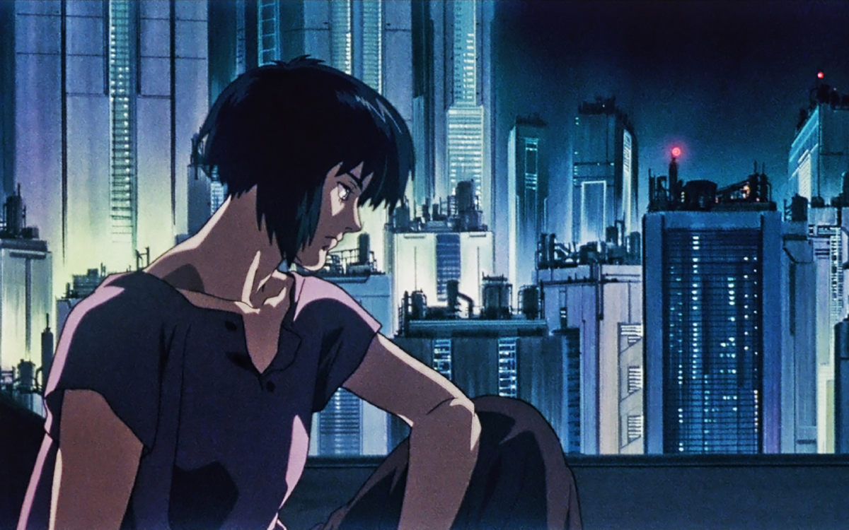 In an anime art style, a girl with short black hair sits looking pensive in front of a cyberpunk city.