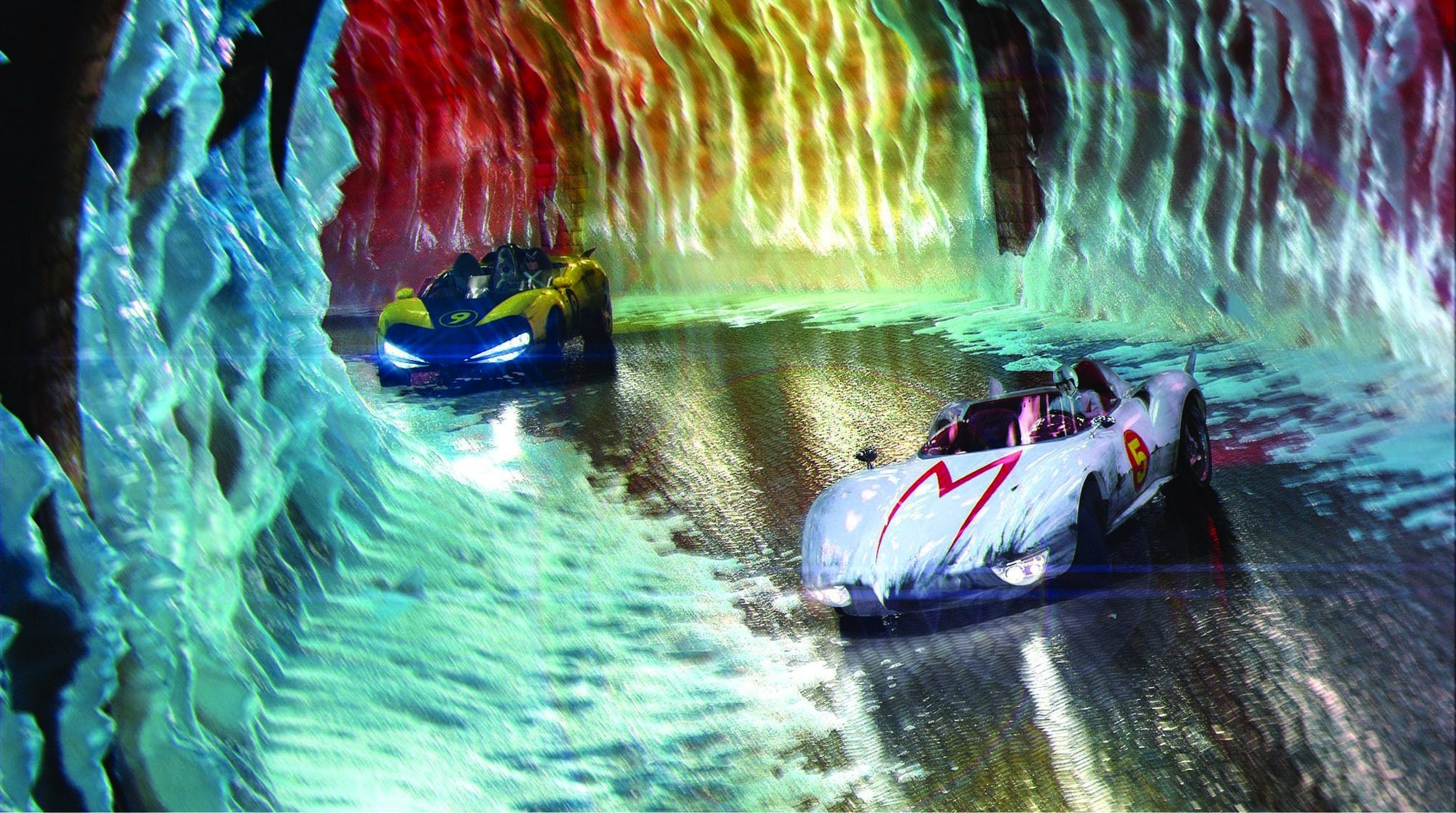 A futuristic white car with a red M on the hood zooms through a tunnel with neon blue and red waterfalls lining the walls, while a darker car with blue headlights chases it.