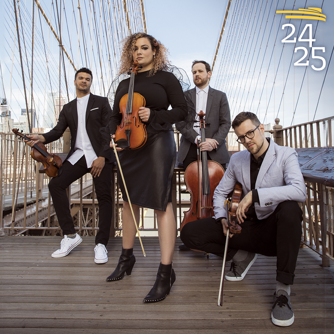 PUBLIQuartet standing in a v formation with their instruments