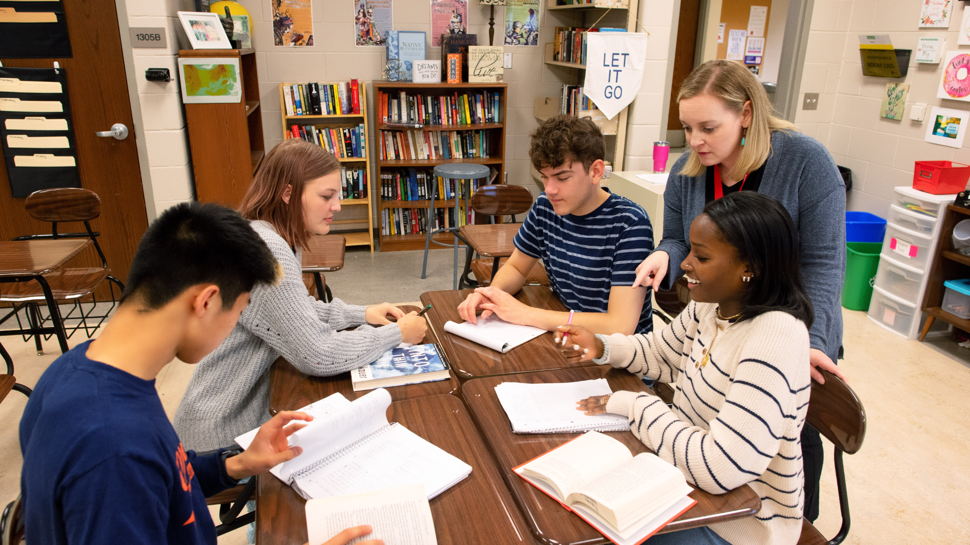 Students working with teacher