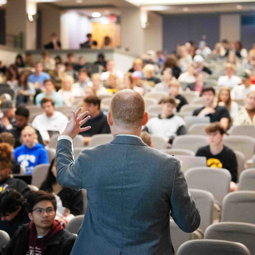 man standing in front of lecture hall