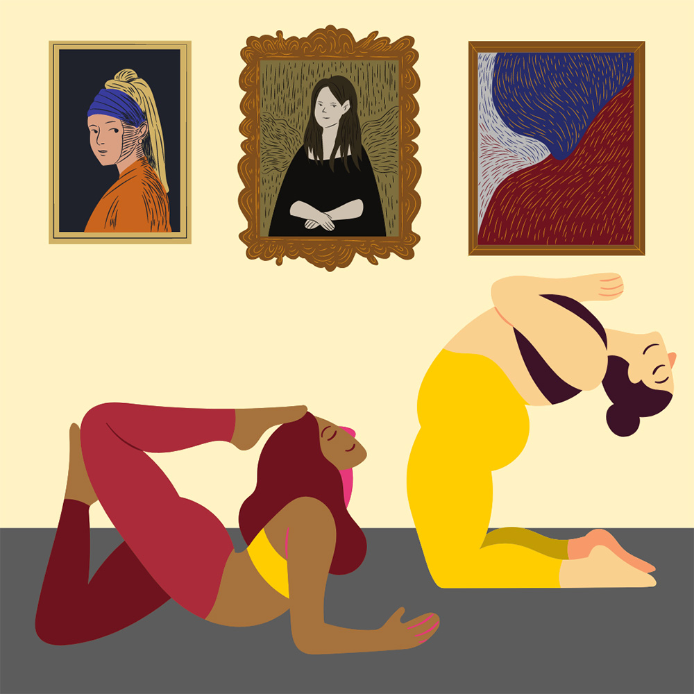 two women perform yoga poses on a rug. there are framed artworks on the wall behind them